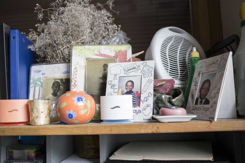 Rochelle Jackson, a single mother of four children,  keeps pictures of her children on her desk at Pittsburgh-based Just Harvest, where she works in welfare advocacy.