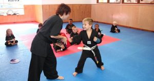Kids learn basic kicks, blocks and strikes at Kinder Karate. Image courtesy of Kinder Karate.