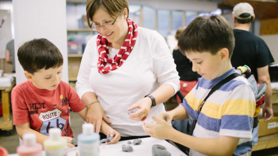 Kids work with modeling clay at a "maker party," part of the 2014 City of Learning.