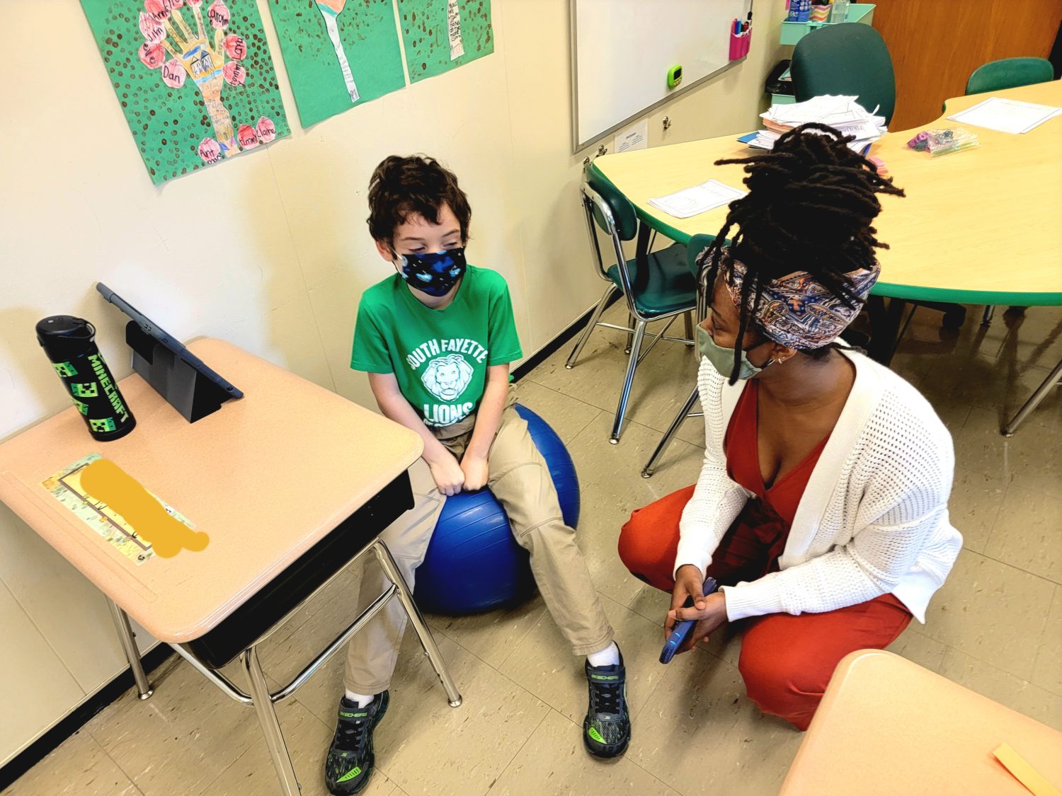 Howard University education student Daejah Parks talks with a South Fayette elementary schooler during the inaugural OTIS visit